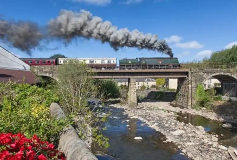 East Lancashire Railway train travelling over a bridge