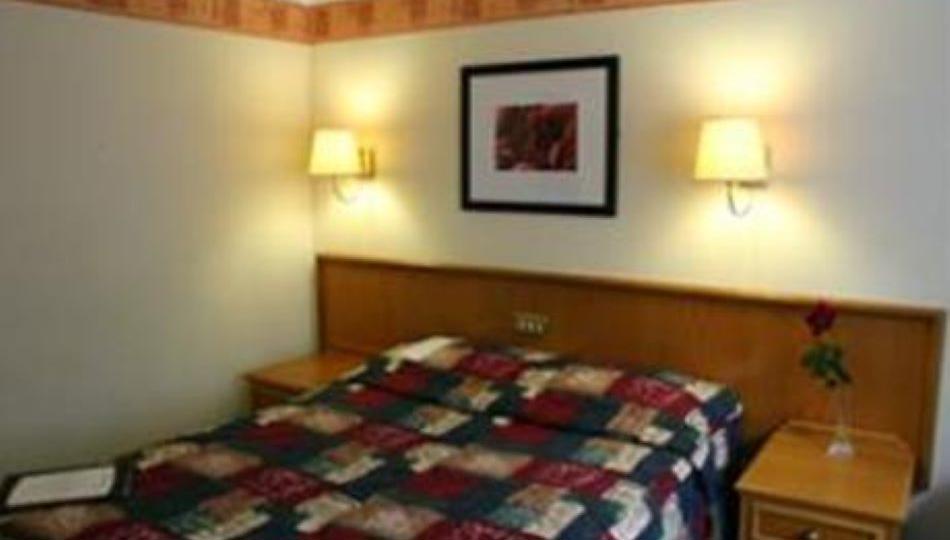 Bedroom at Fairways Lodge